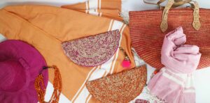 Colorful woven bags, scarves, and accessories on display.